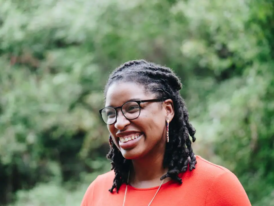 Brown-skinned professional returning to work with coffee