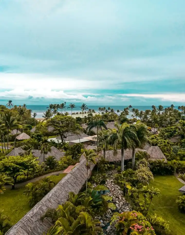 Houses and trees beside the water in Fiji