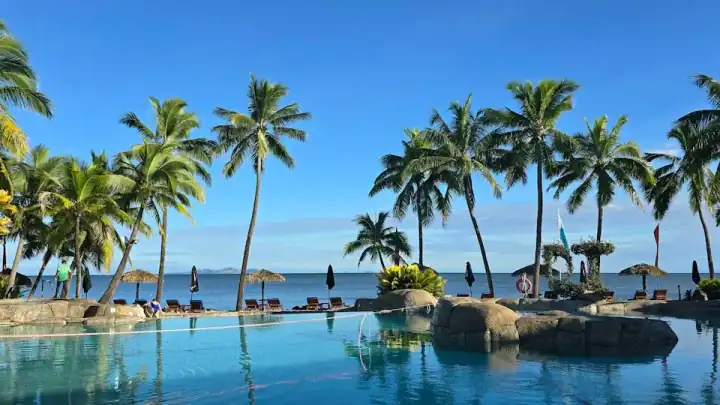 Palm trees and lagoon pool at a Fiji resort