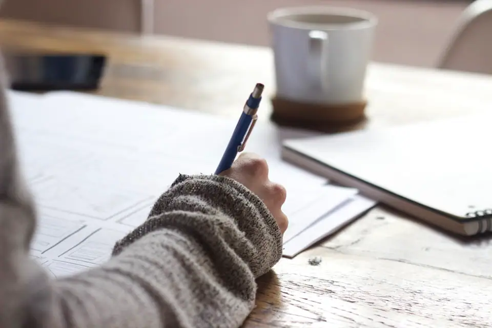 Notebook and planning notes on a desk