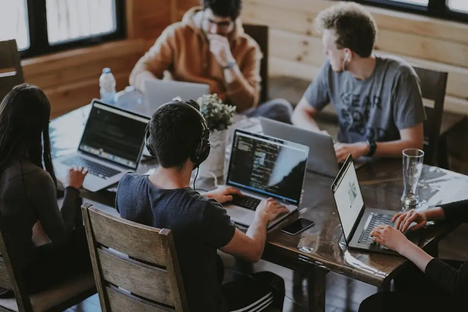 Diverse trainees learning together at work