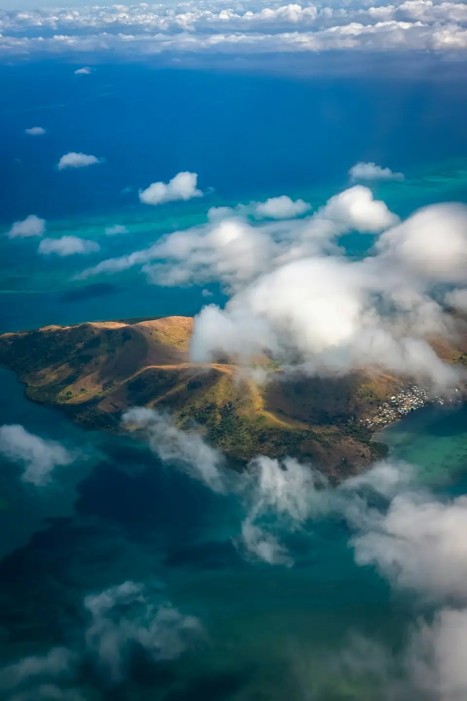 Green Fiji hills and coastline near government work areas