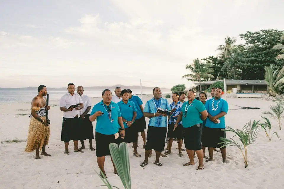 Fijian people standing together on a beach